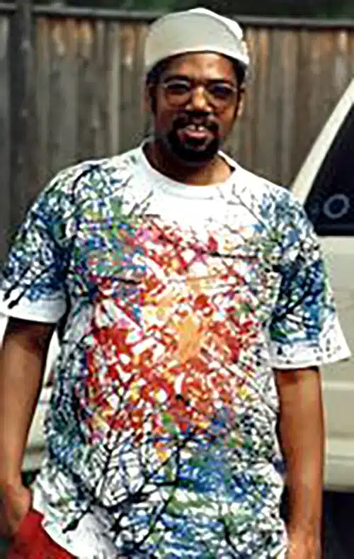 Jim in colorful hand-printed T-shirt.